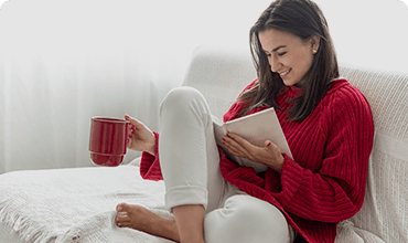 A reader enjoying a Penora title